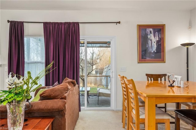 view of carpeted dining area