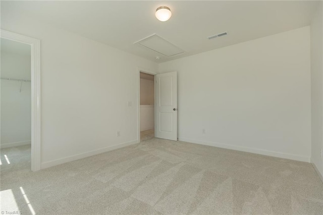 6021 Crestridge Ln Unit 1003, Winston-Salem, NC 27105 - unfurnished bedroom with carpet, a walk in closet, and a closet