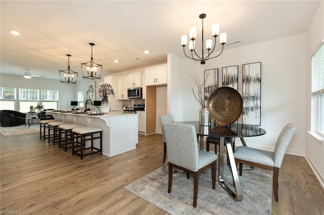 6021 Crestridge Ln Unit 1003, Winston-Salem, NC 27105 - dining room featuring a chandelier, light wood-type flooring, and recessed lighting