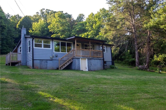 1176 Arbor Grove Church Rd, Millers Creek, NC 28697 - rear view of property featuring stairs, a chimney, a lawn, and a wooden deck