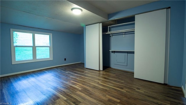 1176 Arbor Grove Church Rd, Millers Creek, NC 28697 - unfurnished bedroom with dark wood finished floors and a closet