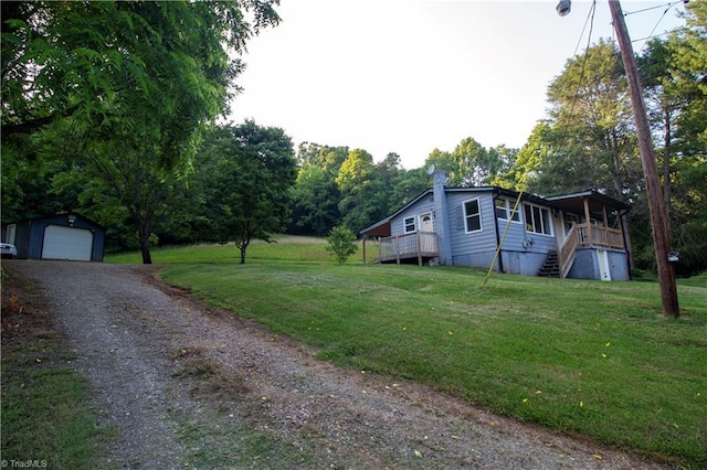 1176 Arbor Grove Church Rd, Millers Creek, NC 28697 - view of property exterior featuring an outdoor structure, stairs, driveway, a garage, and a yard
