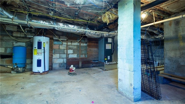 1176 Arbor Grove Church Rd, Millers Creek, NC 28697 - unfinished below grade area with water heater, a water pressure tank, and heating unit