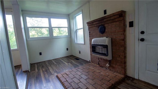 1176 Arbor Grove Church Rd, Millers Creek, NC 28697 - unfurnished living room with heating unit, healthy amount of natural light, and wood finished floors