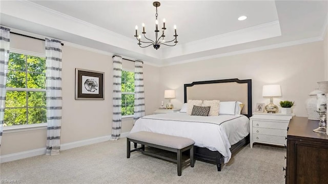 bedroom featuring an inviting chandelier, light colored carpet, a raised ceiling, and crown molding