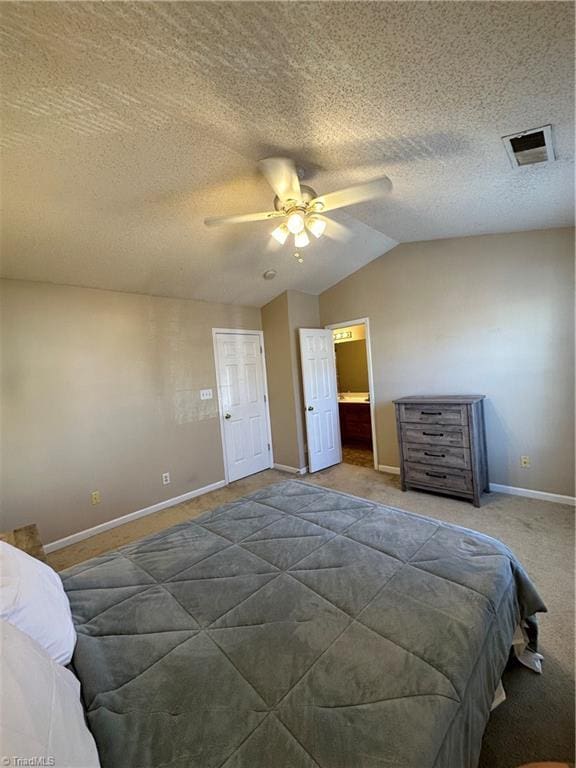 carpeted bedroom with baseboards, visible vents, ceiling fan, vaulted ceiling, and a textured ceiling