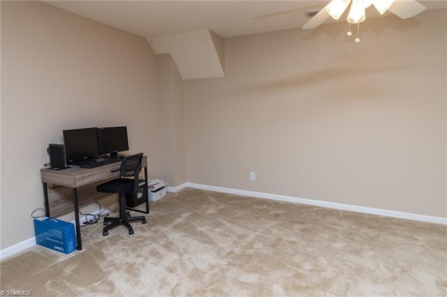 office featuring a ceiling fan, baseboards, and carpet floors