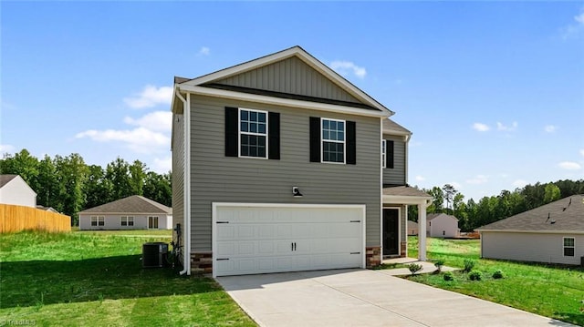 view of front of property featuring central AC unit, a front lawn, and a garage