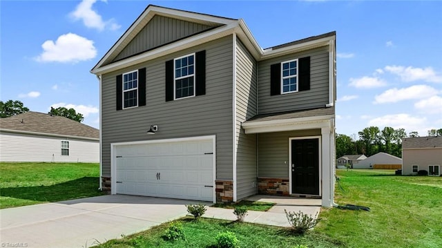 view of front of home with a front lawn and a garage