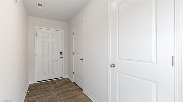 hall featuring dark wood-type flooring