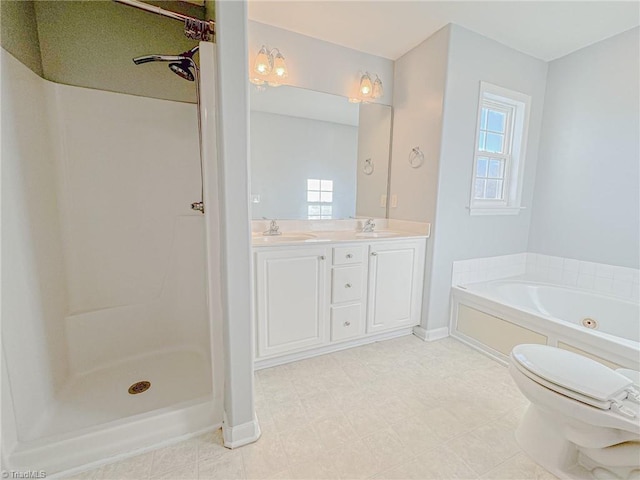 full bath with double vanity, a stall shower, toilet, a bath, and a sink