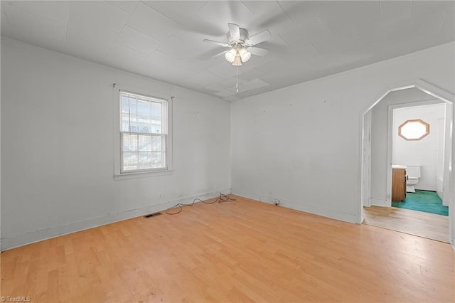 empty room featuring ceiling fan and light hardwood / wood-style floors