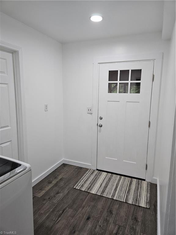 entryway with dark hardwood / wood-style flooring