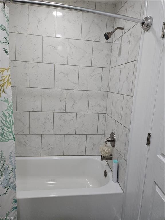 bathroom featuring shower / tub combo with curtain