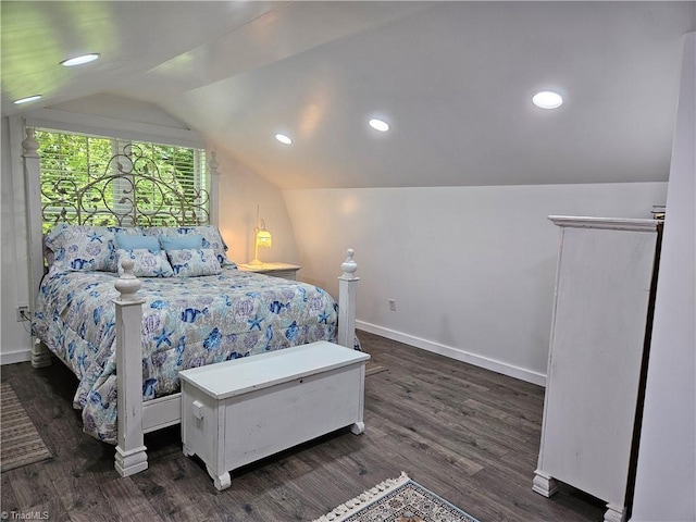 bedroom with lofted ceiling and dark wood-type flooring