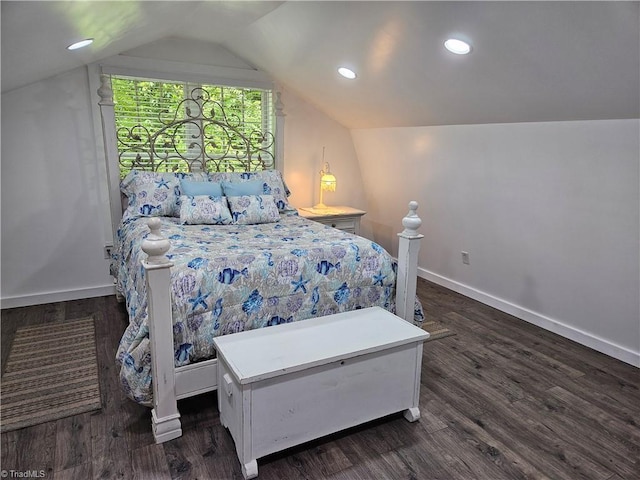 bedroom with dark hardwood / wood-style floors and lofted ceiling