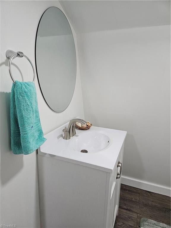 bathroom featuring hardwood / wood-style floors and vanity