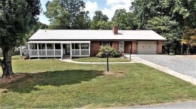 919 Overbrook Dr, Thomasville, NC 27360 - view of front facade featuring an attached garage, covered porch, brick siding, gravel driveway, and a chimney