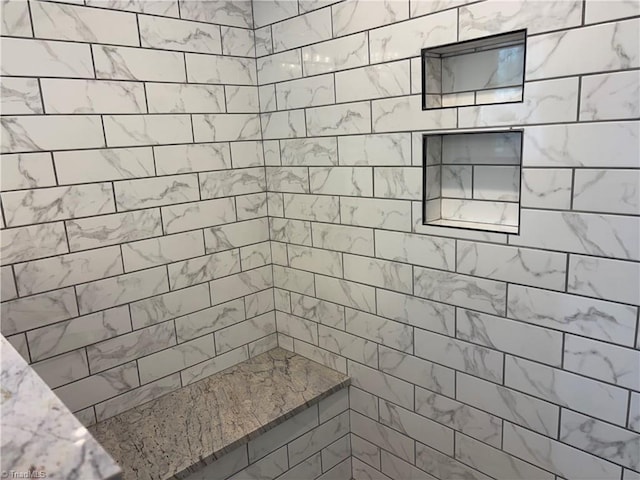 full bathroom with a tile shower