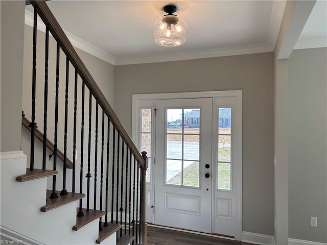 entrance foyer with crown molding, plenty of natural light, and baseboards