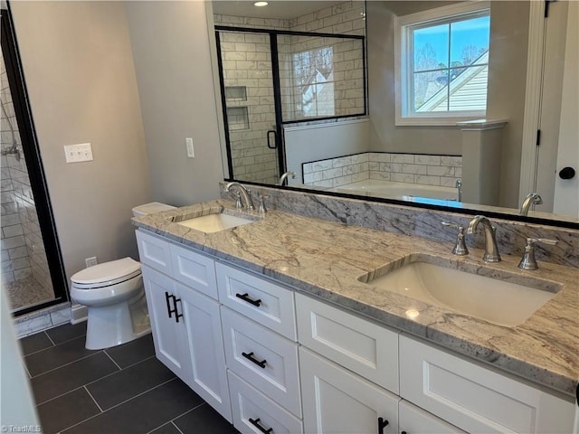 full bath featuring tile patterned flooring, a sink, a shower stall, and double vanity