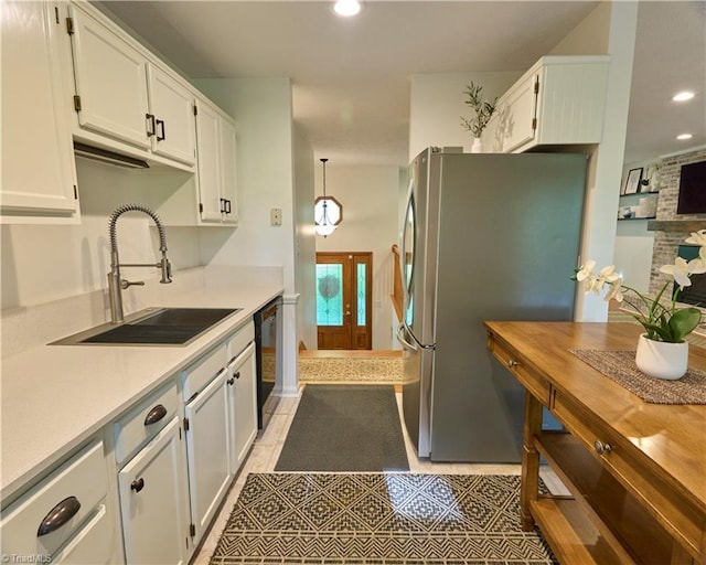 6130 Narrow Way Ln, Winston-Salem, NC 27105 - kitchen with a sink, freestanding refrigerator, dishwasher, light countertops, and white cabinets