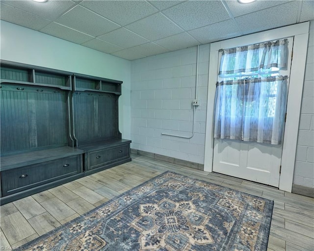6130 Narrow Way Ln, Winston-Salem, NC 27105 - mudroom featuring wood finished floors, a drop ceiling, and concrete block wall