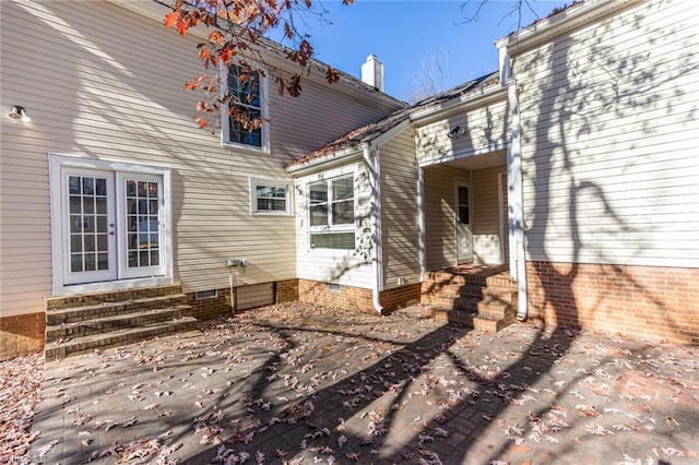 back of house with french doors and a patio