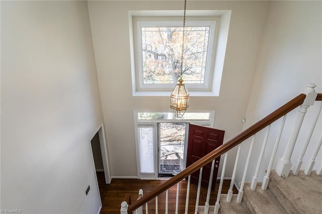 foyer with a high ceiling and an inviting chandelier