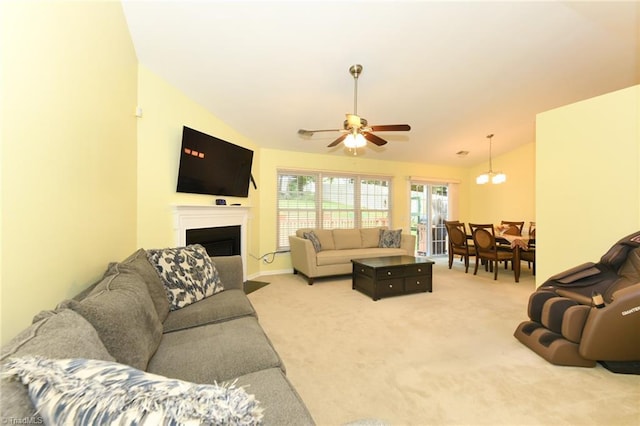 3920 Gisbourne Dr, Jamestown, NC 27282 - living room featuring ceiling fan, light carpet, a fireplace with flush hearth, lofted ceiling, and baseboards