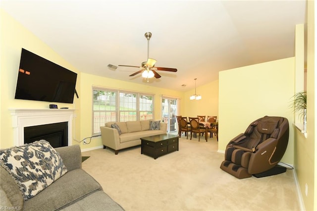 3920 Gisbourne Dr, Jamestown, NC 27282 - carpeted living room featuring lofted ceiling, a ceiling fan, baseboards, and a fireplace