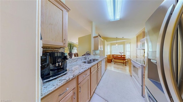 3920 Gisbourne Dr, Jamestown, NC 27282 - kitchen with white appliances, a sink, light brown cabinets, light stone countertops, and light tile patterned floors