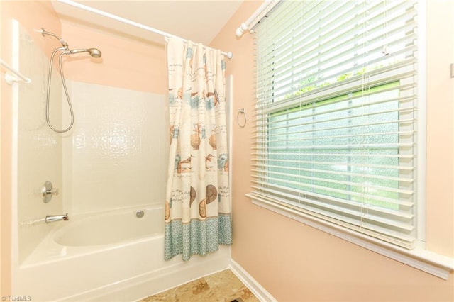 3920 Gisbourne Dr, Jamestown, NC 27282 - bathroom featuring shower / bath combination with curtain and baseboards