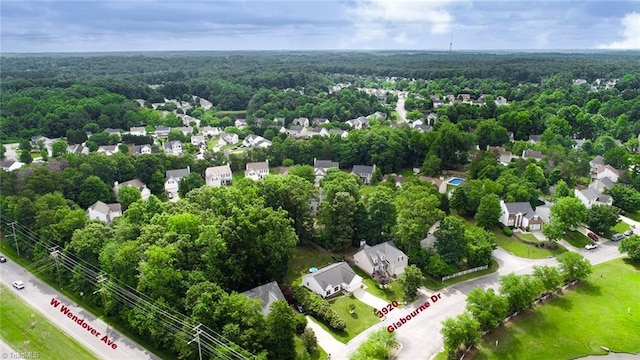 3920 Gisbourne Dr, Jamestown, NC 27282 - aerial perspective of suburban area with a forest