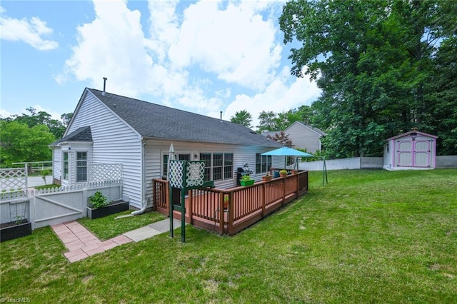 3920 Gisbourne Dr, Jamestown, NC 27282 - back of property with a deck, roof with shingles, and a gate