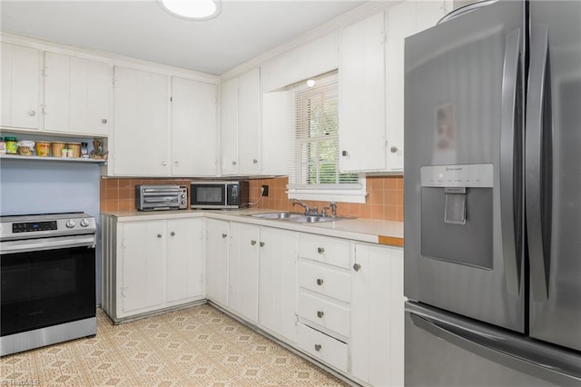 228 Barlow Cir, Winston-Salem, NC 27105 - kitchen featuring stainless steel appliances, a sink, light countertops, and tasteful backsplash