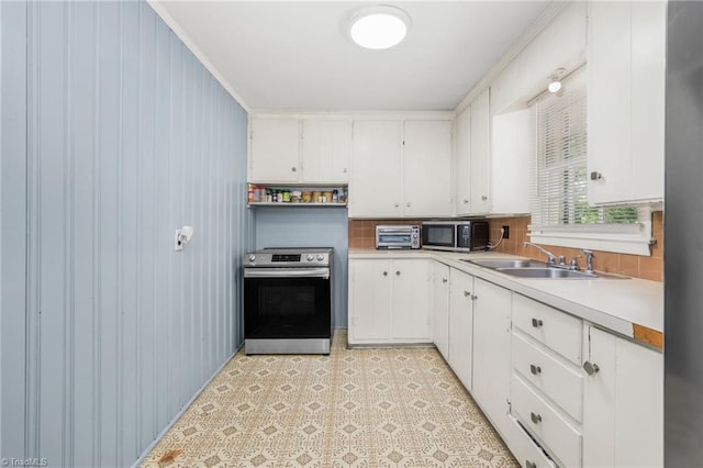 228 Barlow Cir, Winston-Salem, NC 27105 - kitchen with appliances with stainless steel finishes, a sink, white cabinets, and light countertops