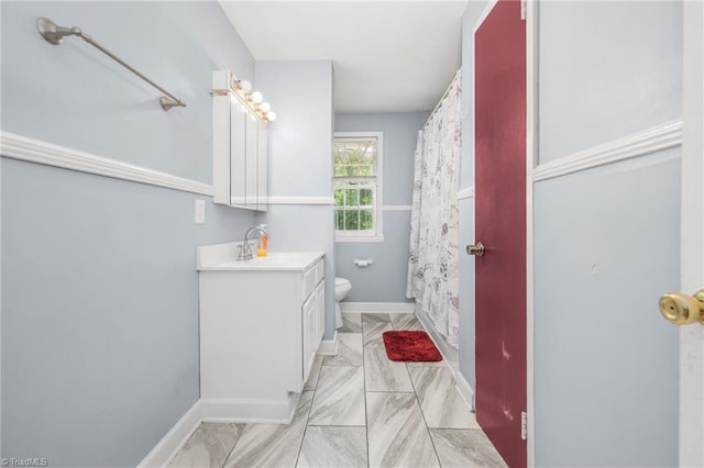 228 Barlow Cir, Winston-Salem, NC 27105 - full bath featuring marble look tiles, toilet, vanity, and baseboards