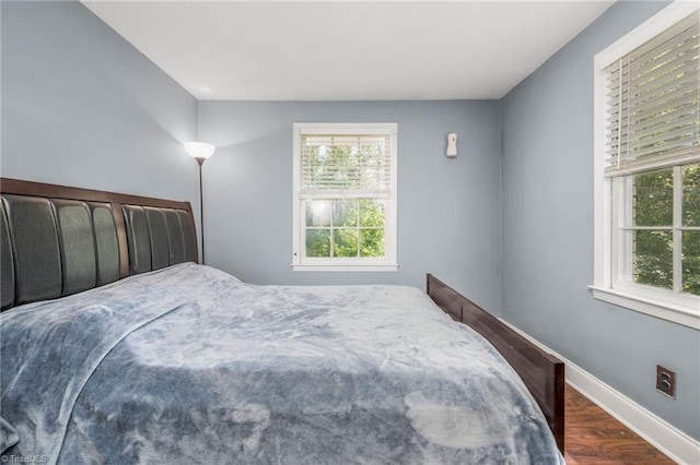 228 Barlow Cir, Winston-Salem, NC 27105 - bedroom featuring multiple windows, wood finished floors, and baseboards