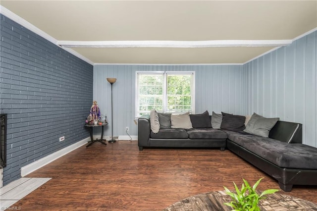 228 Barlow Cir, Winston-Salem, NC 27105 - living room featuring crown molding, brick wall, and wood finished floors
