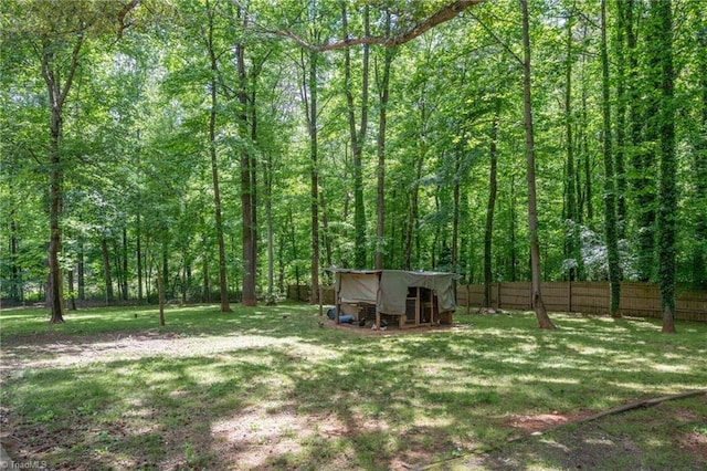 228 Barlow Cir, Winston-Salem, NC 27105 - view of yard with exterior structure, an outbuilding, and a forest view