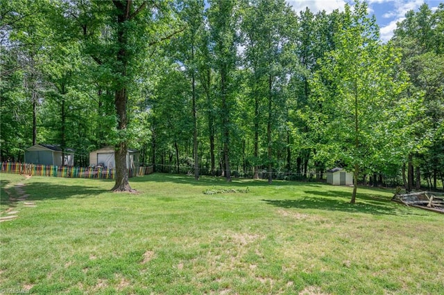 228 Barlow Cir, Winston-Salem, NC 27105 - view of yard featuring a storage unit and an outdoor structure