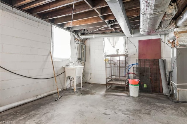 228 Barlow Cir, Winston-Salem, NC 27105 - basement with water heater, healthy amount of natural light, and concrete block wall