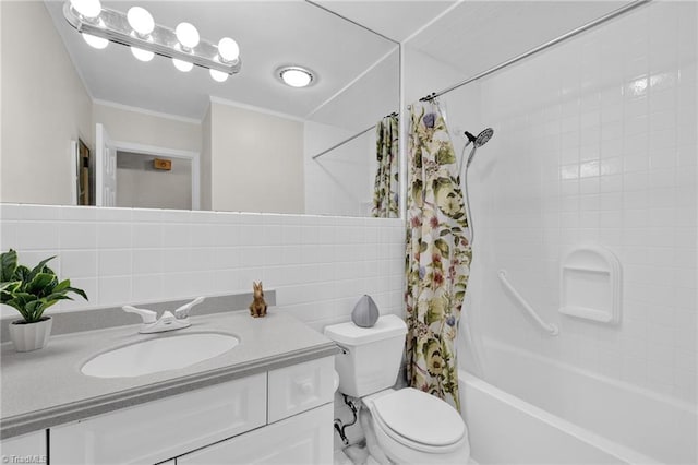 bathroom featuring crown molding, toilet, shower / bath combo with shower curtain, and vanity