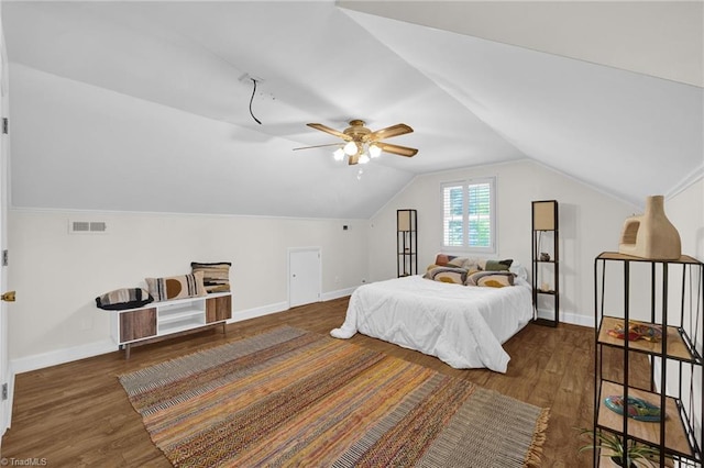 bedroom featuring baseboards, visible vents, and wood finished floors