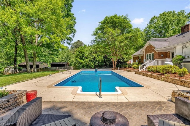 outdoor pool with a patio