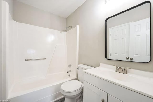 full bathroom with bathing tub / shower combination, vanity, and toilet