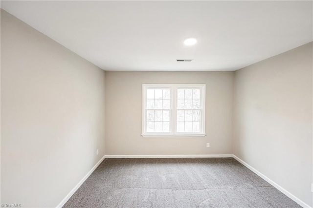 empty room featuring carpet floors