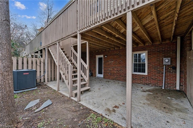 view of patio / terrace with cooling unit and a wooden deck