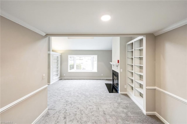 unfurnished living room featuring carpet and ornamental molding